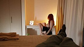 Horny redhead stepmom climbs into stepson's bed. She rides his cock rough.