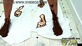 raven rogue's petite feet dunked in giant chocolate pudding tube on beat2feet 🍫👣😋