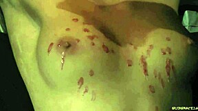 short hair teen drips candle wax on tits in bdsm punishment