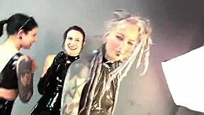 backstage latex femdom shoot with petite goth licking pierced nipples and pussy