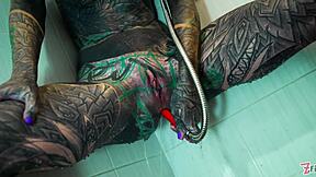 Heavily Tattooed Model's Intense Shower Anal Dildo Play