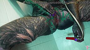 Heavily Tattooed Model's Intense Shower Anal Dildo Play