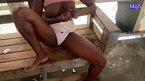 Sexy African milf flashes naughty pussy and tits at public beach