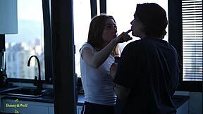 a lesbian couple's cozy kitchen fingering and licking session