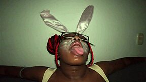 Kinky easter bad bunny ebony nerd Jhodez1 spits on huge pierced black tits deepthroat sloppy cock suck shaking boobs.