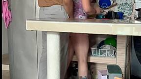 stepmom plays with her big tits in kitchen