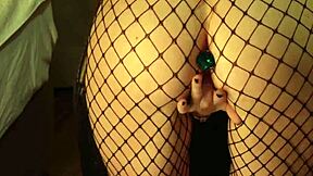 shes fingering shaved pussy in fishnets with buttplug