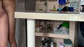stepmom plays with her big tits in kitchen