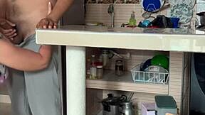 stepmom plays with her big tits in kitchen