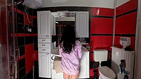 Hot petite brunette babe in the bathroom prepares
