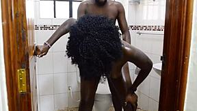 maya explores the bathroom with her ebony skin and huge figure, embracing her milf role in a relaxed setting