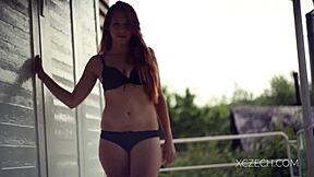 amazing teen is playing with her legs in a solo session