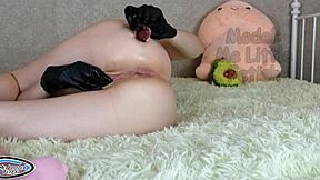 Petite 18+ student in fetish latex gloves pisses while masturbating her big clitoris with stepsister butt plug in ass.