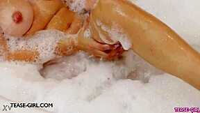 Petite Brunette Model Enjoys Relaxing Bath On Sofa