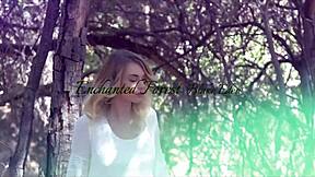 stunning blonde beauty gets naked between the trees in outdoor setting