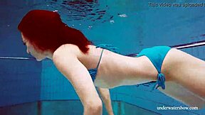 Martina shows off her blue bikini underwater