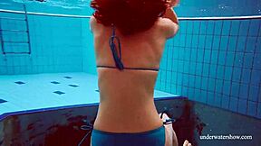 Martina shows off her blue bikini underwater