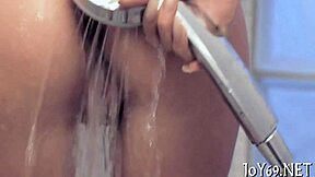 Petite teen stimulates huge tits and tight pussy alone