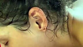 Pretty young woman talks on phone in public