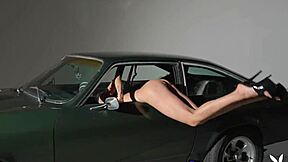 Scarlett Kapella, this skinny tall MILF, is stripping down and posing naked on the car hood, showing off her natural tits and pussy.