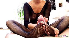 Slim Photo Model Gives POV Footjob In Fishnets