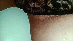 A cute latina babe engages in private activity in a public restroom, captured on hidden camera.