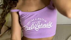 young stepsister explores with a big black dildo at home in homemade setting.