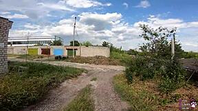 the horny student with long hair and brown eyes gives a sloppy blowjob behind the garages