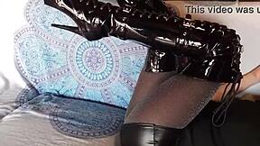 brunette milf in total black fishnets and over-the-knee boots