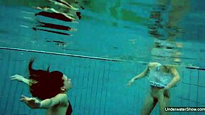 two hot lesbians splashing in the pool 😍