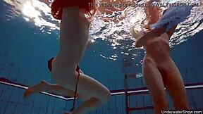 two hot lesbians splashing in the pool 😍