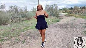 Ebony with big ass walks upskirt in sneakers.