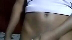 kenyan crossdresser strips and relaxes at home.