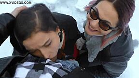 two hot girls warm a cock with blowjobs in the snow outdoors