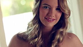 Kenna James strips beautifully, revealing her shaved pussy.