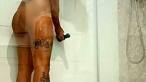 Hot teen gets super horny in the shower playing with her dildo!