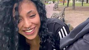 A person drinks milk in a public park in Buenos Aires during the day