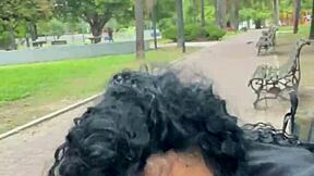 A person drinks milk in a public park in Buenos Aires during the day
