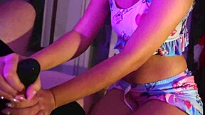 A petite cute girl gives a handjob over underwear, leading to orgasm