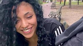 A person drinks milk in a public park in Buenos Aires during the day