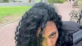 A person drinks milk in a public park in Buenos Aires during the day