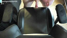 In the bedroom, the redhead teen masturbates her huge cock for a massive cum spray