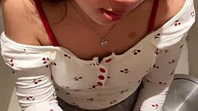 18-year-old asian girl gives blowjob in public restroom, ending with huge cumshot on her face