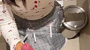 18-year-old asian girl gives blowjob in public restroom, ending with huge cumshot on her face