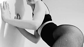 petite german brunette teases in fishnet tights and leggings