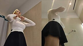 Blonde Tries On Skirts, Flashing Panties in Changing Room