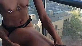 Kashofficials bent over on the balcony, getting her tight pussy strapped hard by renity love