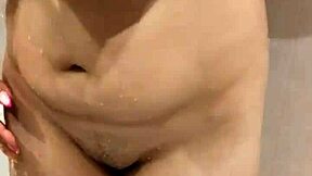 My step sister allows me to watch her shower, enjoying the voyeur attention.