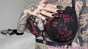 Melody Radford tries on black and purple lingerie and micro bikini in detailed haul