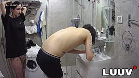 I join my boyfriend in the shower with webcam on, showing my shaved pussy.